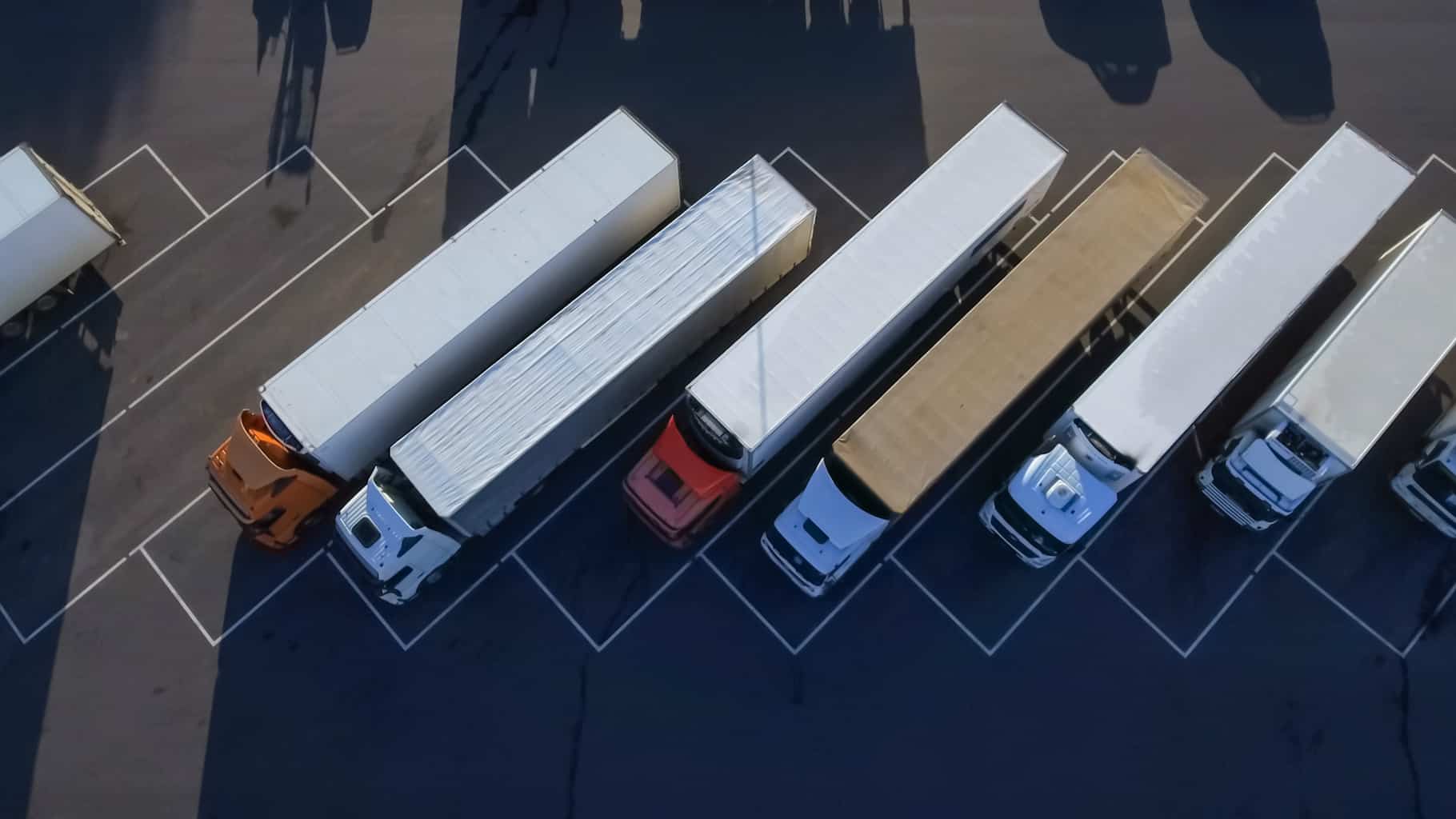 birds eye view of trucks in line