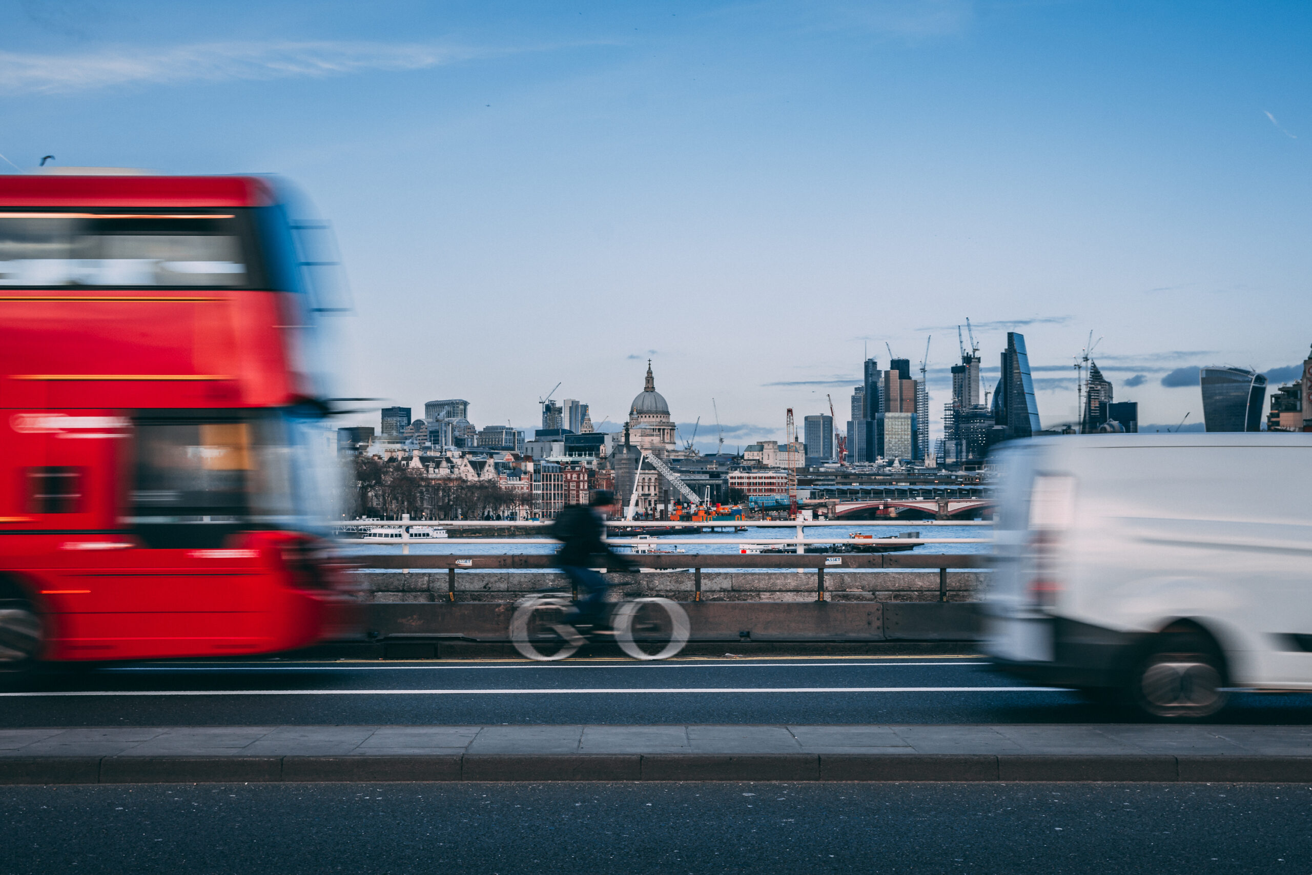 Cyclist red bus London