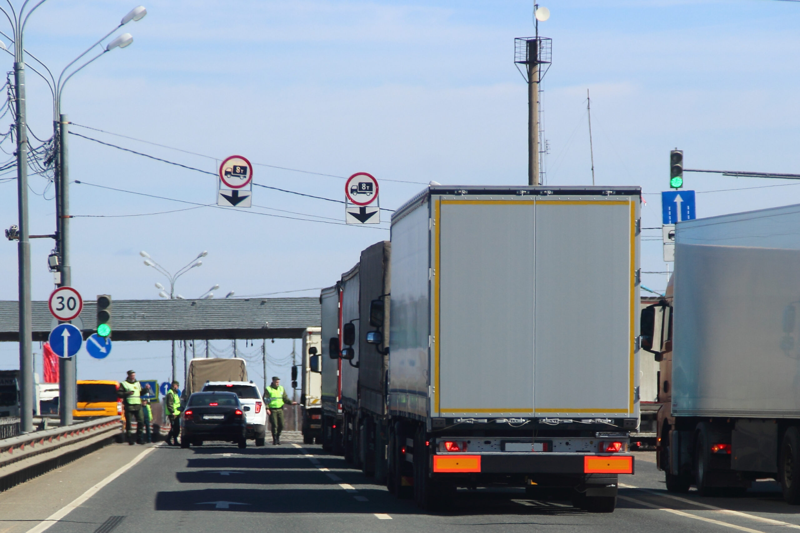 Truck inspection at UK border to prevent clandestine entrant penalty and ensure compliance with security regulations.