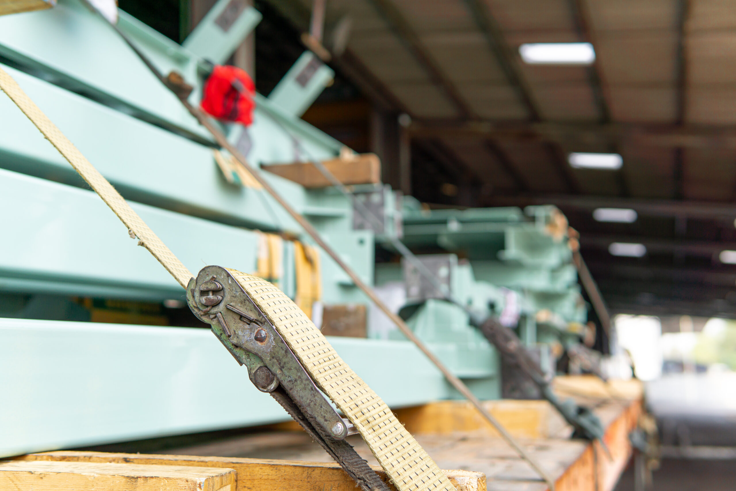 Strapped pallets loaded into a truck for safe transportation, following DVSA load security guidance for 2024.