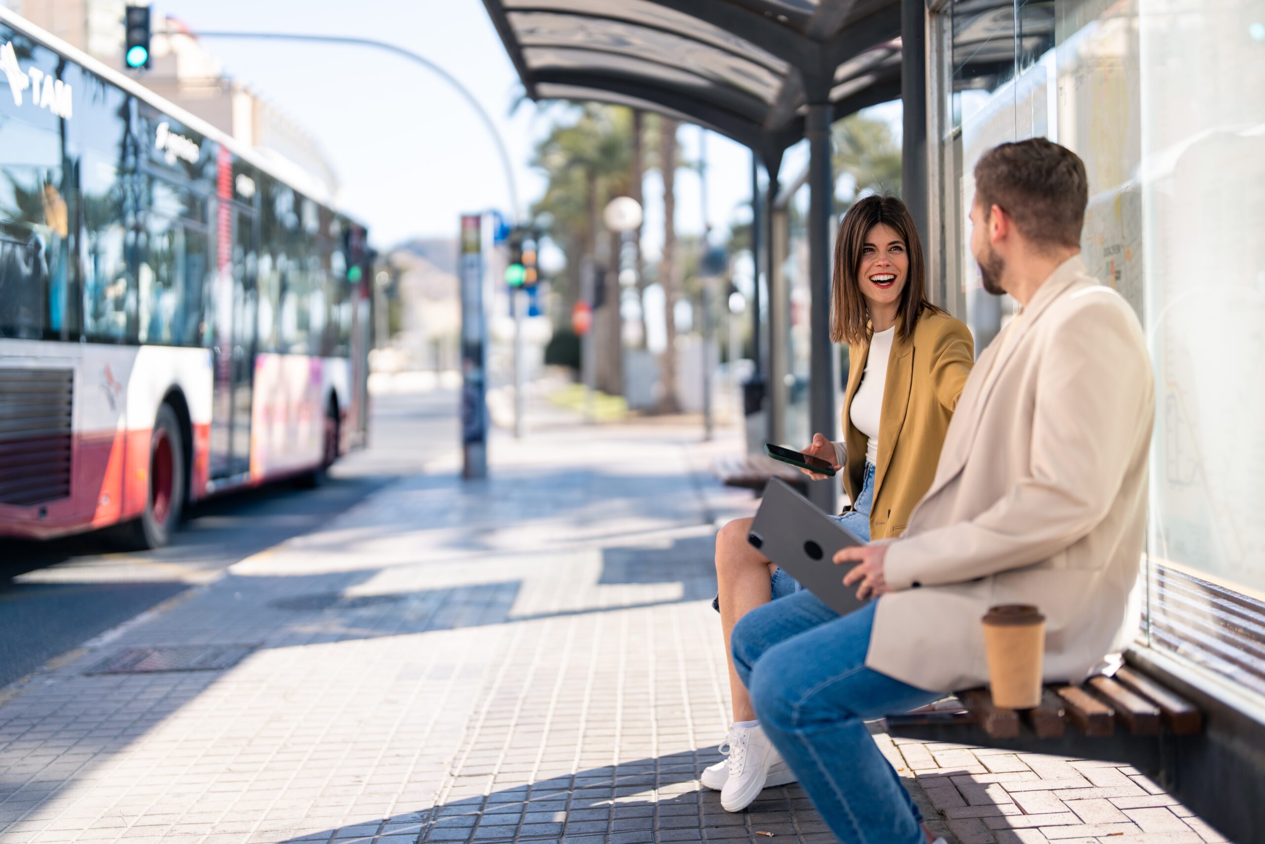 People waiting at a bus stop.