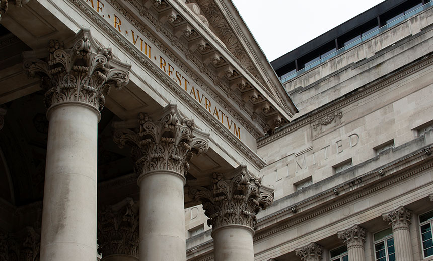 Historic legal building in London with classical columns and Latin inscription