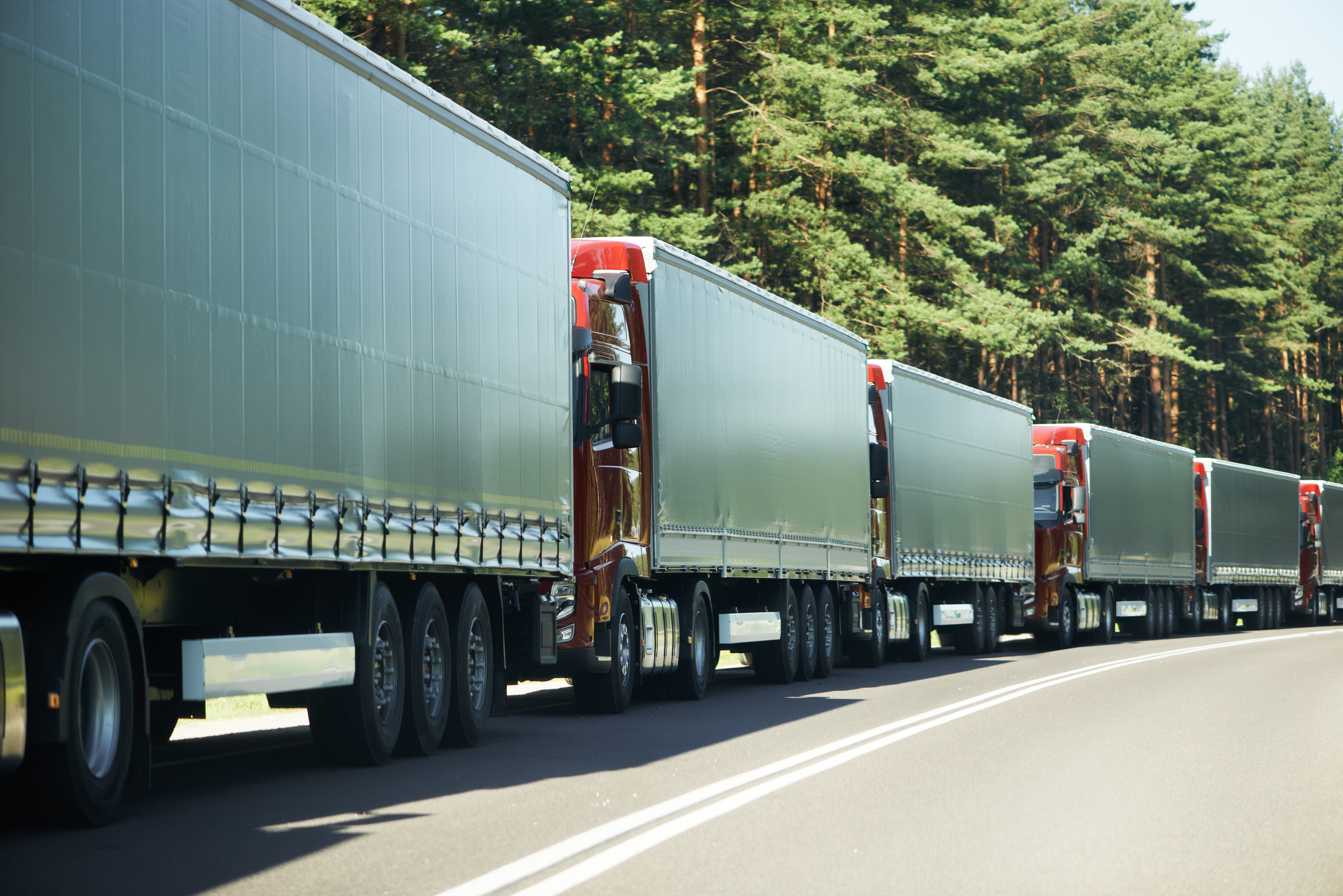 Lorries and cars waiting in traffic at a UK border control checkpoint.