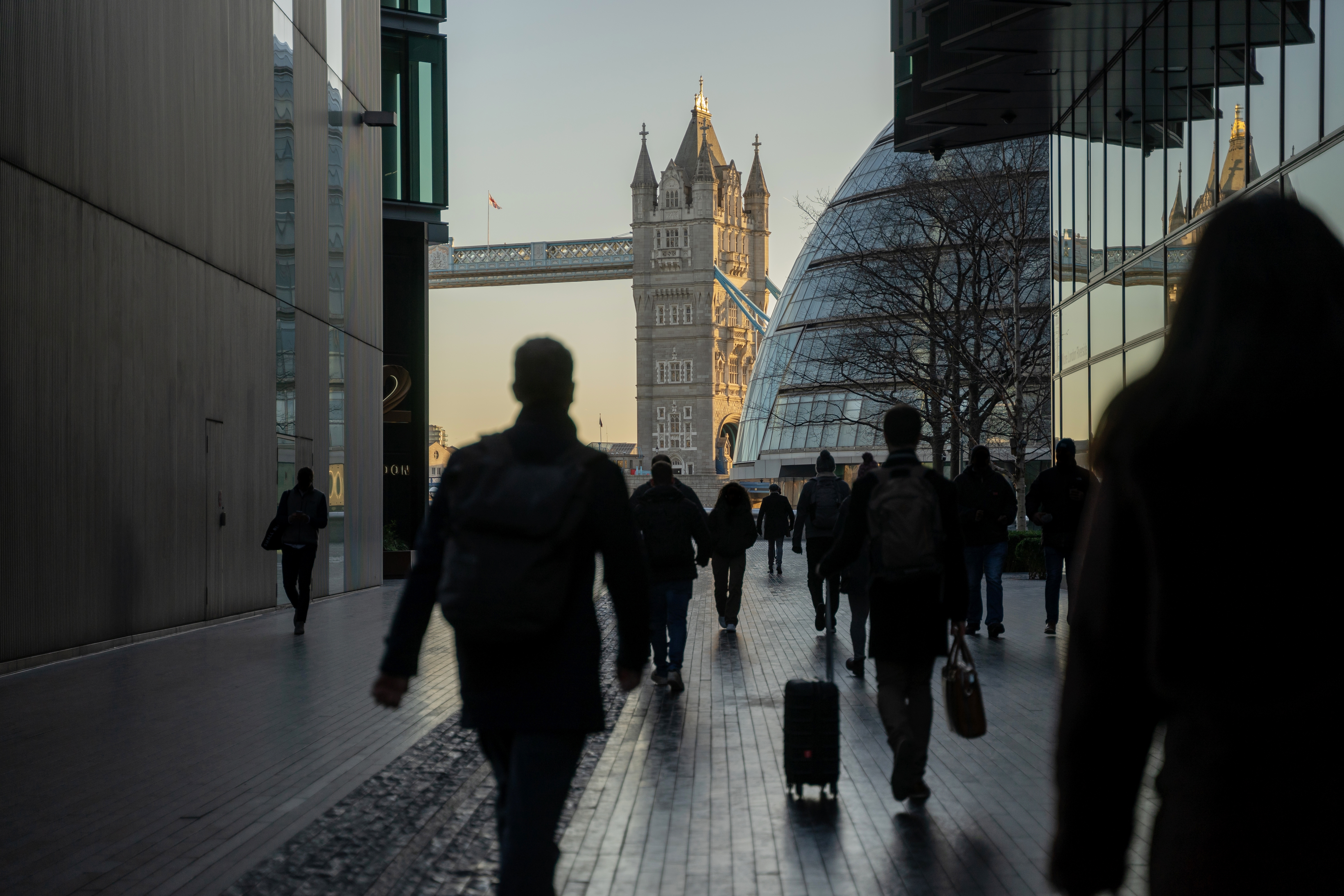 Commuters walking through central London during rush hour.