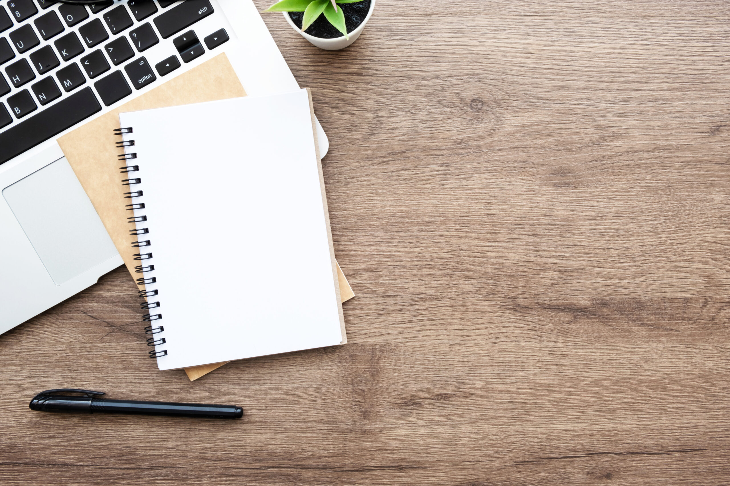 Desk with notepad and pen, symbolising Companies House identity verification and corporate compliance tasks