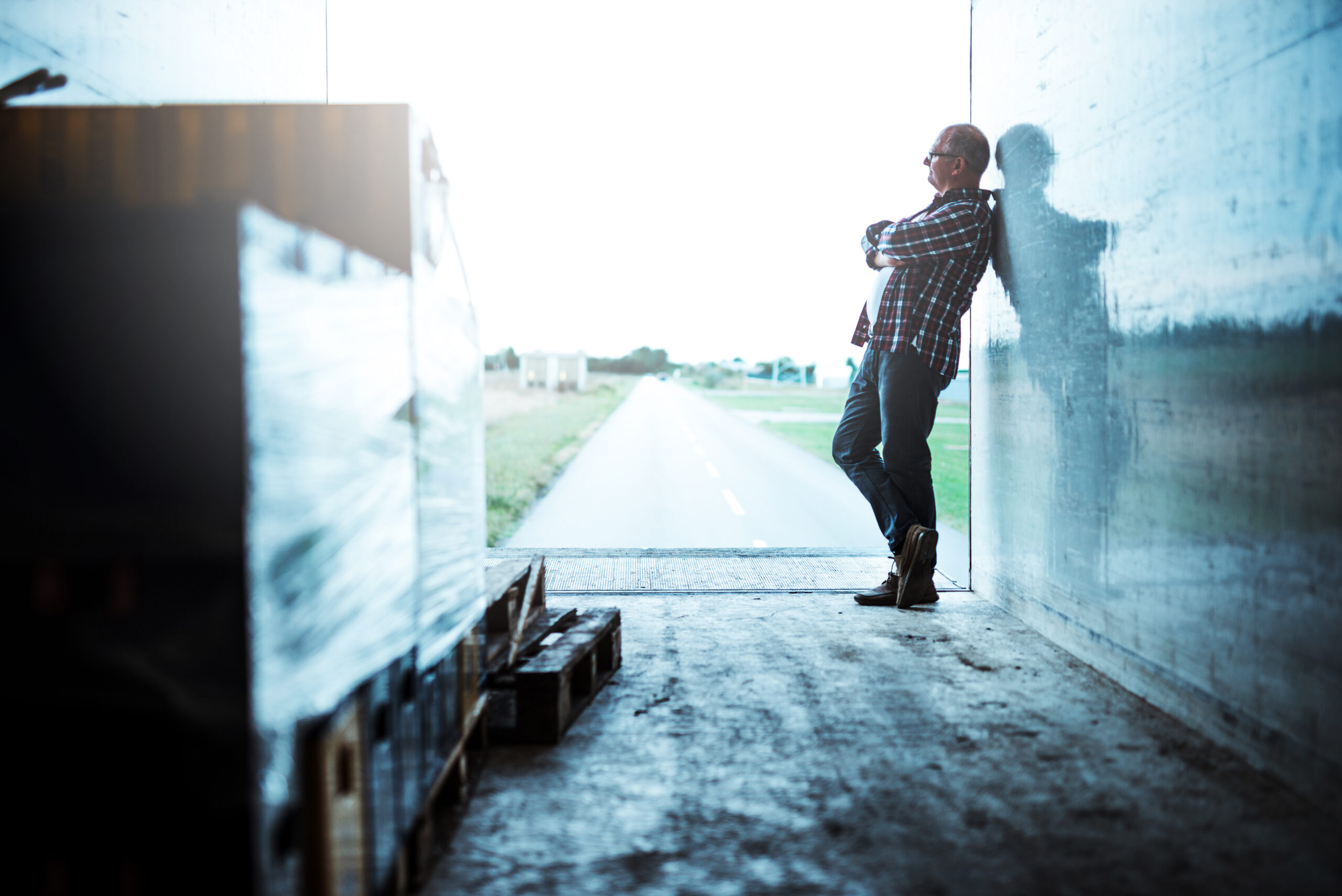 HGV driver standing beside a lorry representing employment dismissal case law.