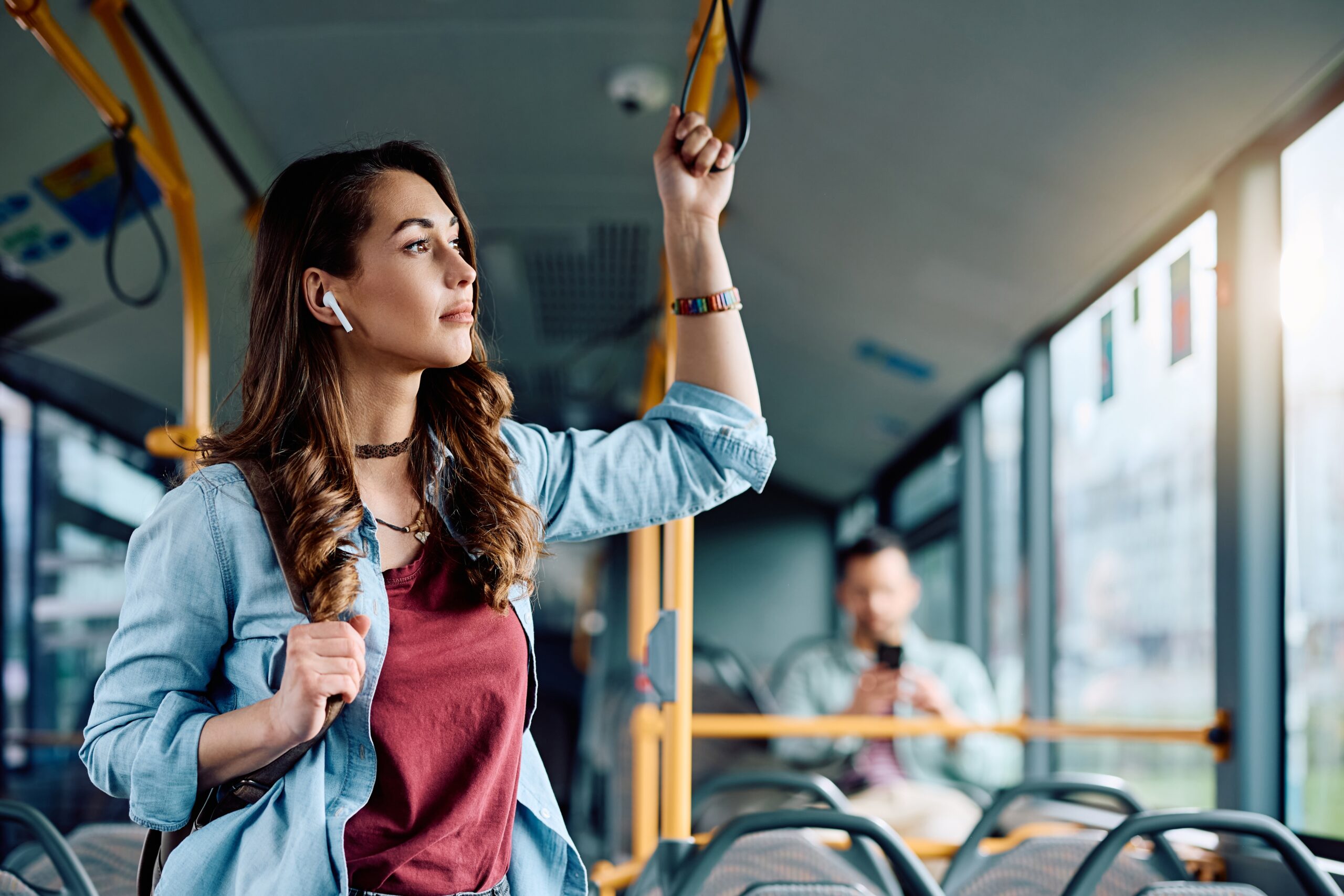 Passenger boarding a local bus in England following the Government's announcement of the return of the £2 bus fare cap.