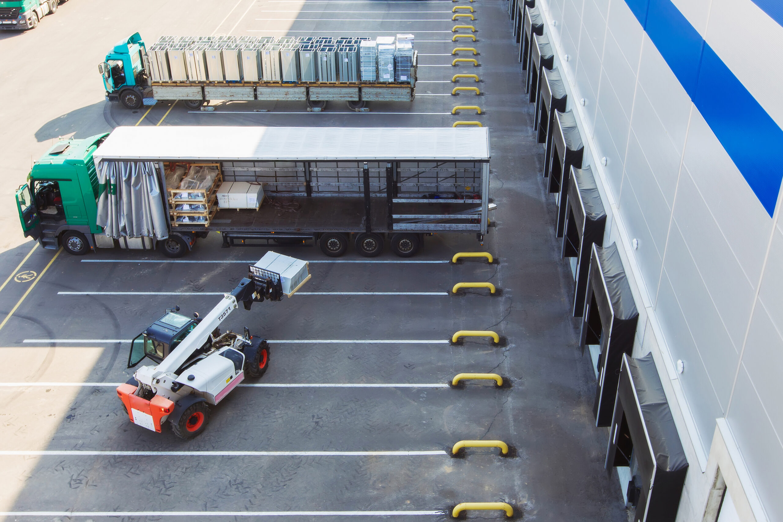 Warehouse with clearly marked pedestrian walkways and forklift operating safely.
