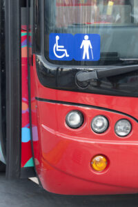 Front of a bus displaying a disabled access symbol.