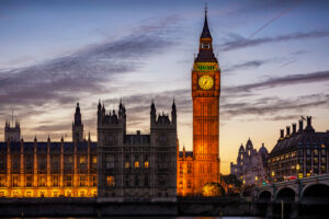 UK Parliament at sunset, illustrating the Autumn Budget 2026 and its implications for the transport sector.
